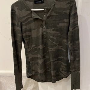 Green camouflage long sleeve shirt. 5 snaps on top by neck. Size small